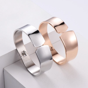 Polished minimalist stainless steel spring bracelets in silver and rose gold finishes
