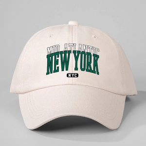 Beige cotton baseball cap featuring green New York NYC embroidery in a classic 6-panel design