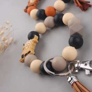 Silicone beaded bracelet keychain with cartoon highland cow charm and leather tassel