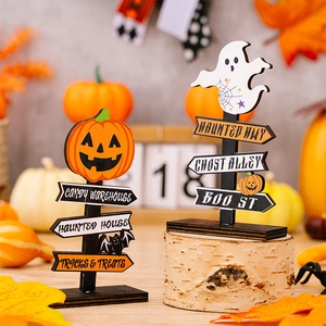 Macro detail of wooden Halloween road signs featuring pumpkin and ghost decorative motifs