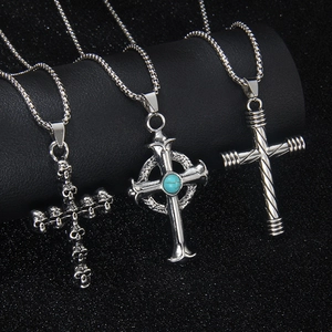 Three vintage hip-hop stainless steel necklaces with cross and skull wing pendants