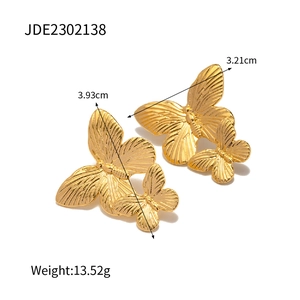 Detail view of gold butterfly earrings showing dimensions 3.93cm and weight 13.52g