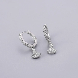 Detailed shot of silver hoop earrings featuring a sparkling pavé zircon fan pendant