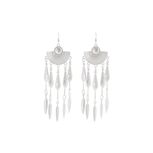 Close-up of Bohemian silver tassel earrings with geometric carving and feather charms