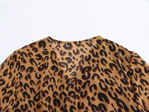 Detail of French vintage leopard print dress featuring a V-neckline and lightweight fabric