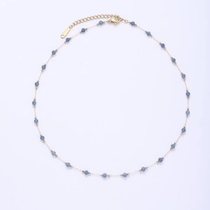Close-up of golden stainless steel chain with faceted blue natural stone beads and clasp