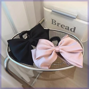 Elegant large satin double-layered bow hair claw clips in black and soft pink colors
