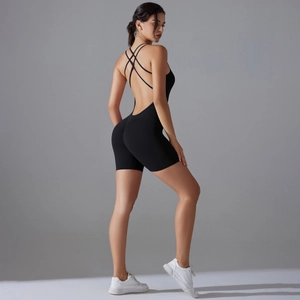 Close-up of black athletic bodysuit with cross-back straps and high-stretch fabric details