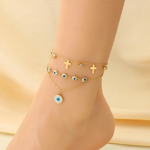 Bracelet de cheville double en acier doré avec perles œil grec et pendentif croix