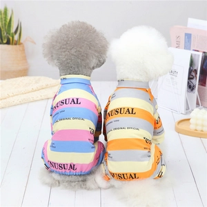 British style striped dog pajamas for small pets shown in a cozy home setting