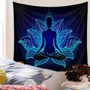 Detailed view of meditation tapestry with neon lotus and silhouette in a bedroom setup