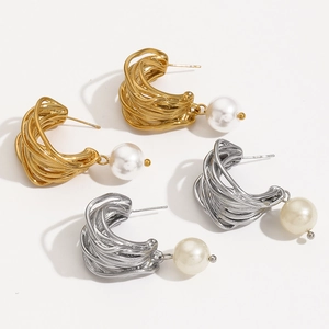 Irregular C-shaped twisted wire hoop earrings with large pearls in gold and silver