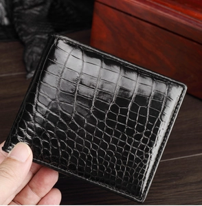 Detailed close-up of premium black crocodile pattern leather wallet for men's business style