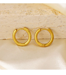 Detail of 18K gold plated stainless steel hoop earrings on elegant silk and stone