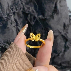 Exquisite gold butterfly ring with twisted band design and artistic matte finish texture