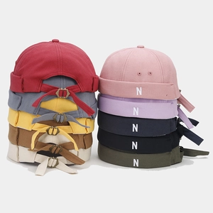 Detail of cotton docker hats with N embroidery and adjustable metal buckle in multiple colors