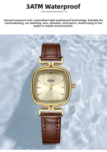 Close-up of vintage square gold watch with 3ATM waterproof detail on blue water background