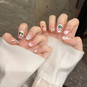 Handmade press-on nails featuring cute cherry and cat designs in a pink and white French style