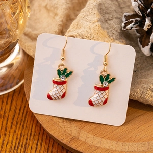 Detail of Christmas stocking drop earrings with red enamel and sparkling rhinestones