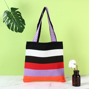 Rainbow striped knitted shoulder bag with purple handles for casual daily use