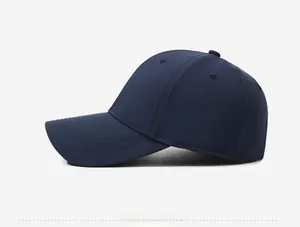 Side view of dark blue baseball cap with classic curved brim and six-panel stitching