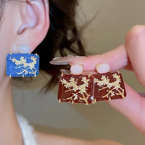 Detail of square enamel flower earrings with jade-style beads in vintage Chinese style