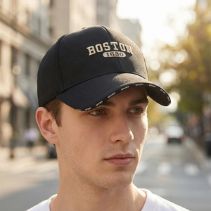 Classic black baseball cap with Boston 1630 embroidery and decorative brim text
