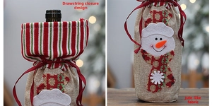 Detail of Christmas wine bottle bag with linen texture, snowman patch, and drawstring closure