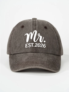 Detailed close-up of vintage washed charcoal baseball cap featuring Mr. EST.2026 print