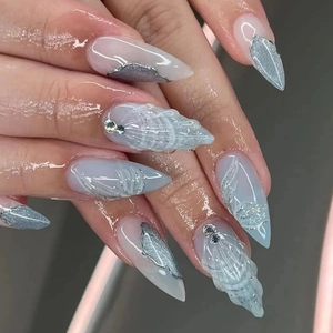 3D shell texture blue and silver stiletto press-on nails with rhinestone ocean theme