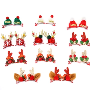 Set of 11 pairs of festive Christmas hair clips with glitter reindeer antlers and mini hats