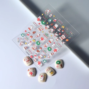 Detailed view of FEB-600 Christmas nail stickers with 3D embossed Santa and snowflake