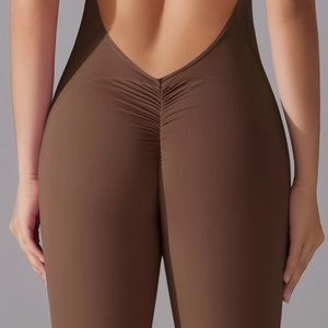 Detail of dark brown backless jumpsuit featuring scrunch butt lifting seam design