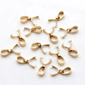Golden stainless steel pinch bails for pendant jewelry making on white background