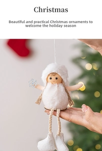 Detail of white plush angel ornament with silver snowflake and twine legs on Christmas tree