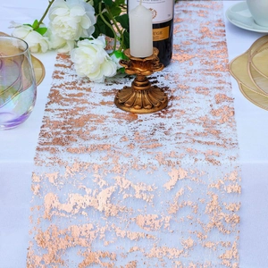 Rose gold foil patterns on white mesh table runner for elegant party table decor