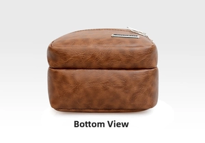 Detailed bottom view of the brown PU leather messenger bag showing the grainy texture