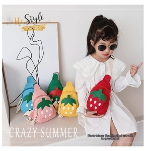 Detailed view of colorful strawberry chest bags with tassel zippers for kids fashion