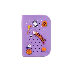 DIY purple silicone pencil case with Halloween pumpkin and ghost charms on white background