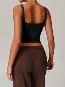Close-up back view of a slim fit black Y2K yoga tank top with elegant open back design