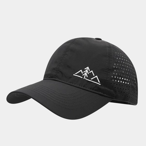 Detail of laser-cut ventilation holes on a quick-dry black outdoor mountain baseball cap