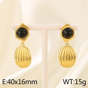 Detailed view of gold stainless steel oval drop earrings with black gemstone inlays