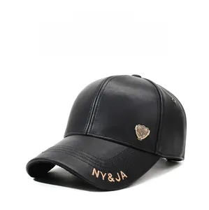 Detail of black faux leather baseball cap with NY&JA embroidery and metal shield logo