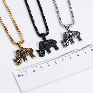 Detailed comparison of African elephant pendants in gold, black, and silver finishes