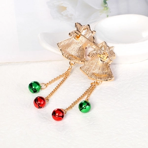 Christmas gold bell brooch with red and green pendants shown from the back pin structure