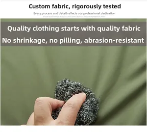Détail macro du tissu de sweat vert armée résistant au boulochage et à l'abrasion
