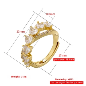 Detailed view of adjustable gold-plated ring with sparkling heart-shaped zircon stones