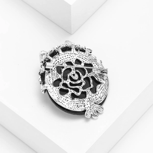 Retro silver owl brooch back view showing rose hollow pattern and secure safety pin
