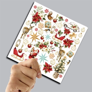 Close-up of vintage Christmas scrapbooking paper with reindeer and Santa Claus motifs