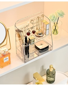 Detailed view of PET clear makeup organizer with hooks for jewelry on a vanity